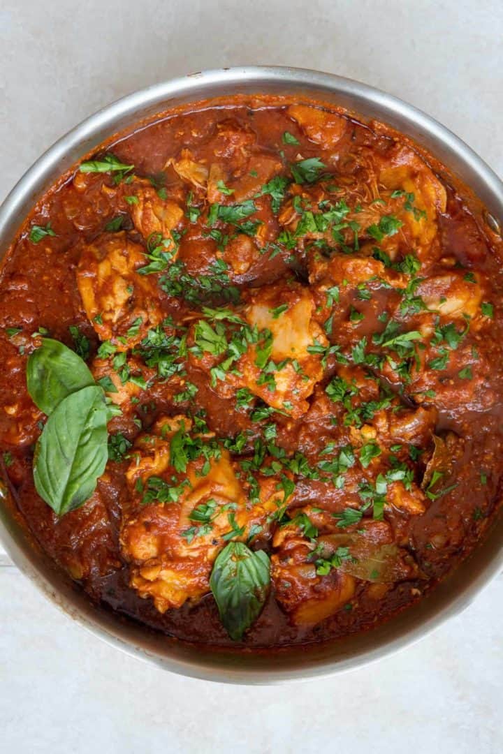 This Chicken Arrabiata Recipe is made with bone-in chicken, onions, artichokes, Arrabiata sauce, and simmered into perfection.
