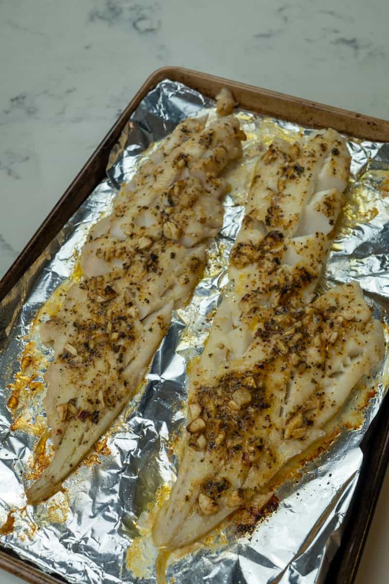 This Baked Cajun Cod is made with butter, olive oil, garlic, cajun or creole seasoning and baked to a flaky perfection.