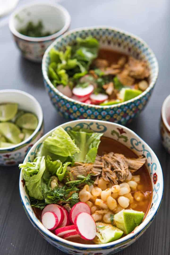 This Pozole Recipe is made with pork shoulder, chiles anchos, chiles guajillos, onion, garlic, oregano and hominy.
