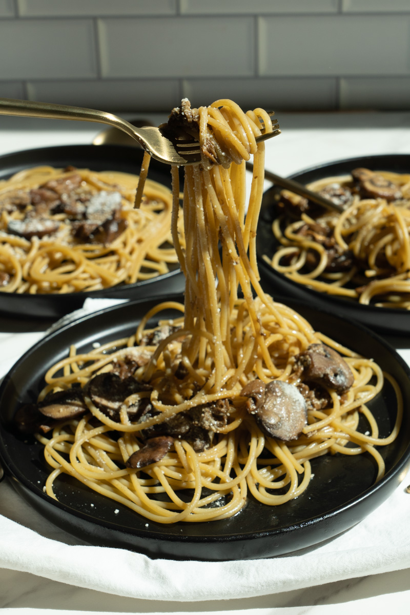 This Mushroom Pasta without Cream is made with dried porcini mushrooms, butter, white wine, pasta and topped with parmesan cheese.