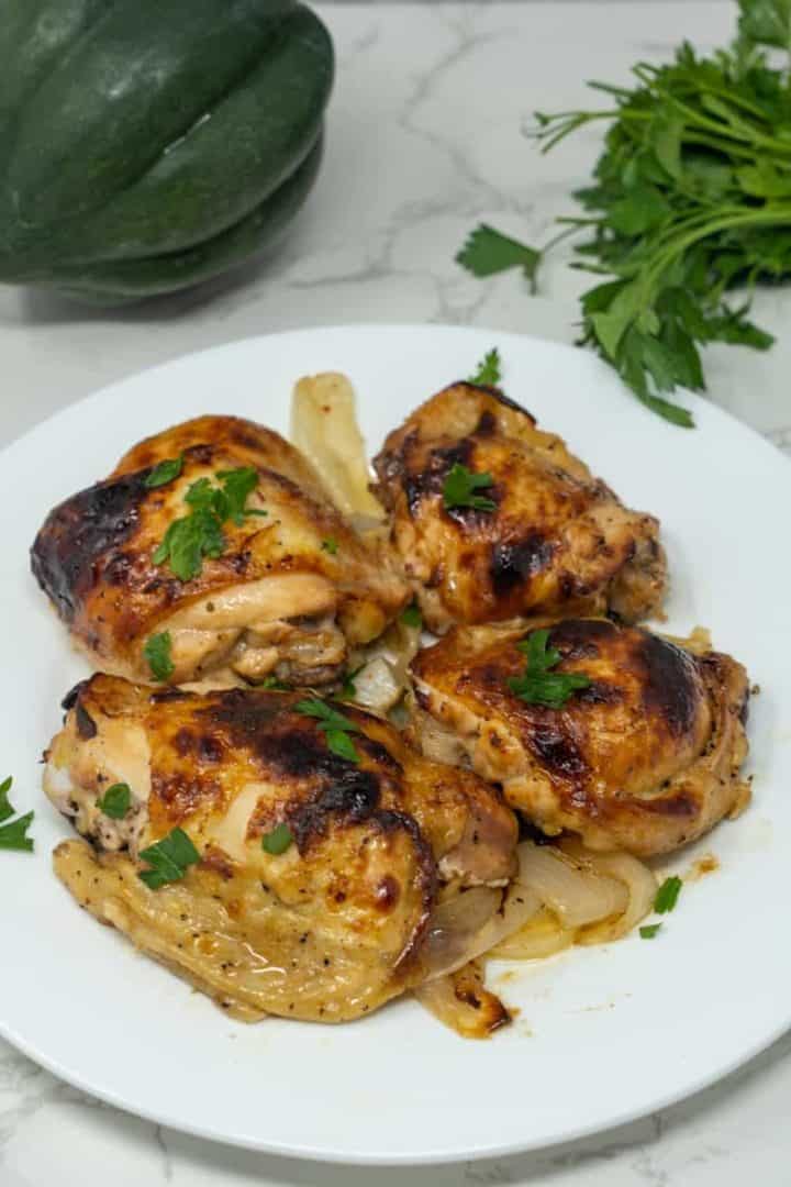 This Chicken in Italian Dressing dish is made with a whole chicken, a bottle of Italian dressing, onions, and lemons.
