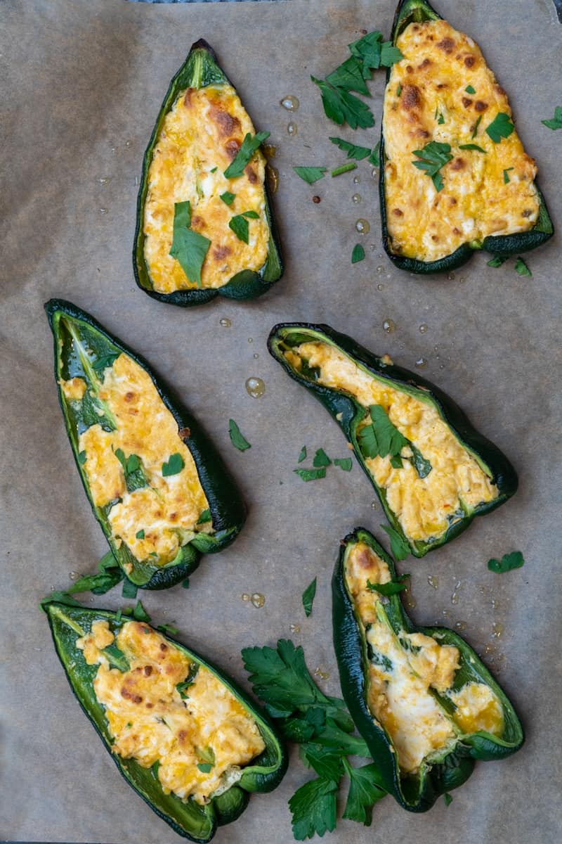 This Cream Cheese Stuffed Poblano Peppers dish is made with poblano peppers, shredded cheese, cream cheese, paprika, chili powder, lime and salt.