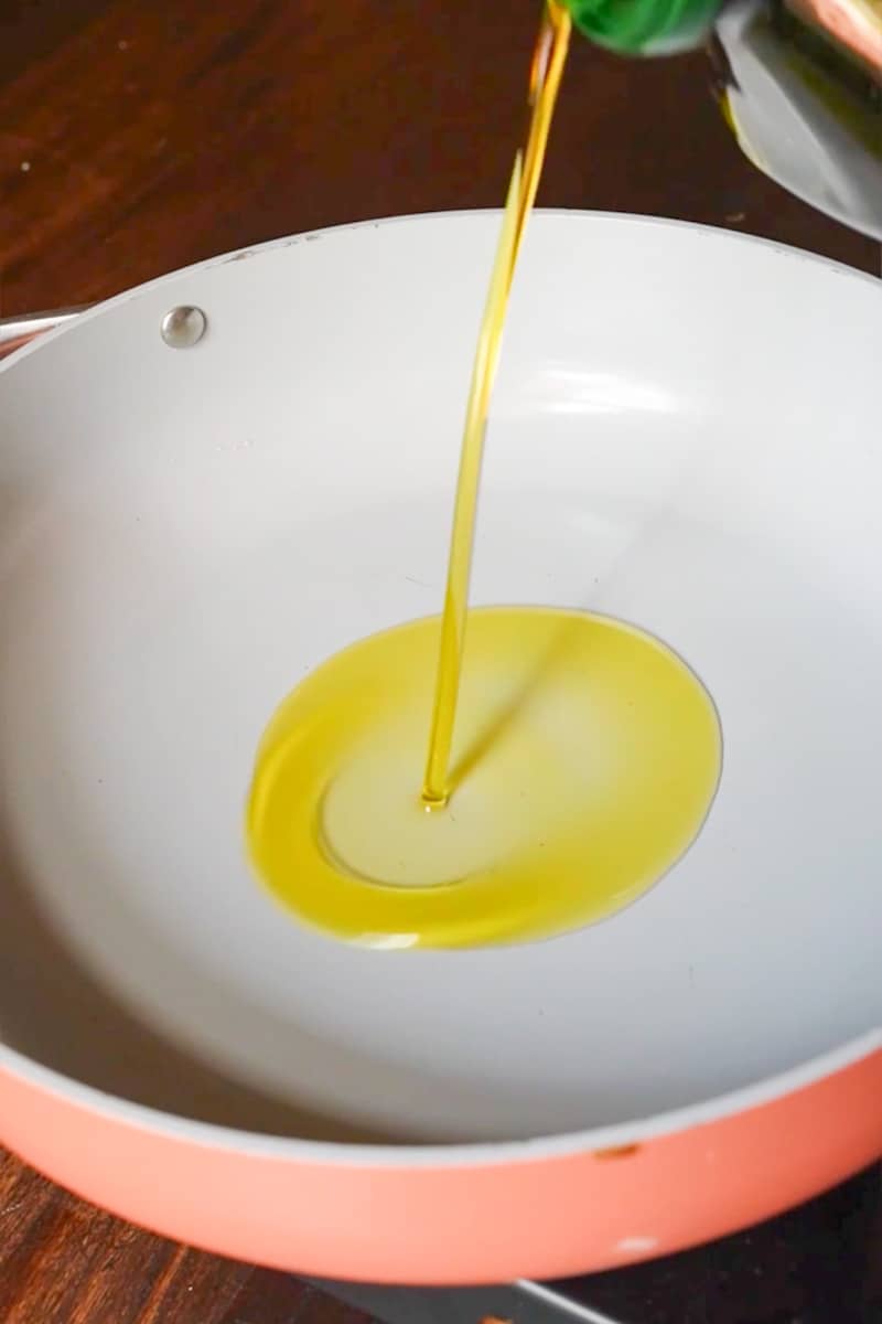 Rinse the shishito peppers and pat them dry with a paper towel. Heat a large skillet or frying pan over medium-high heat.Add the vegetable oil to the hot pan and swirl it around to coat the bottom.