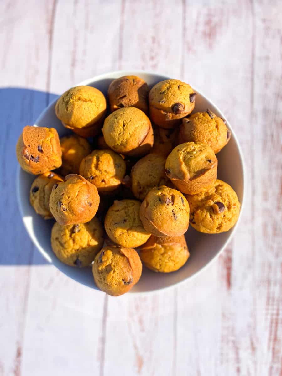 This Pumpkin Chocolate Chip Muffins Recipe is made with pumpkin, chocolate chips, flour, eggs, baking soda, cinnamon, sugar, and nutmeg.