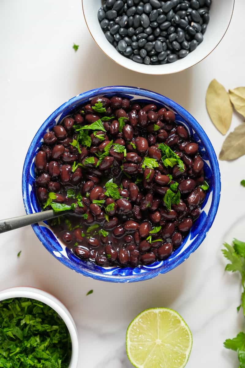 This Instant Pot Black Beans Recipe is made with dried black beans, lime, cilantro, broth and pressure cooked in an Instant Pot.