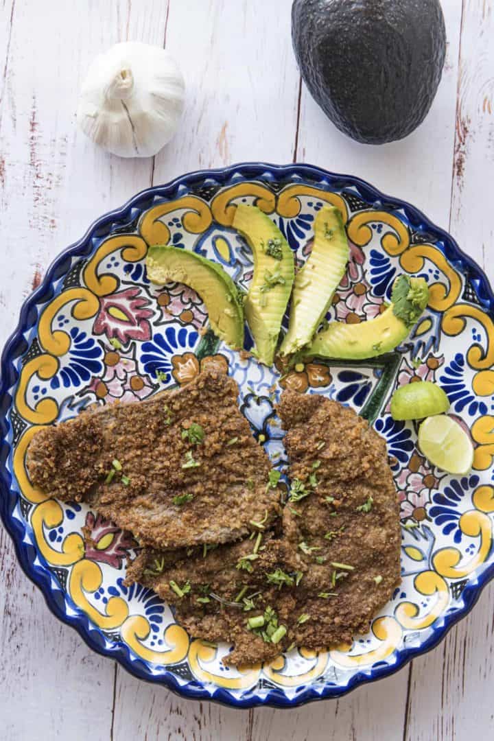 This is a Milanesa Recipe that is made by dipping thin-cut sirloin in eggs, tossing in bread crumbs, and then lightly frying.