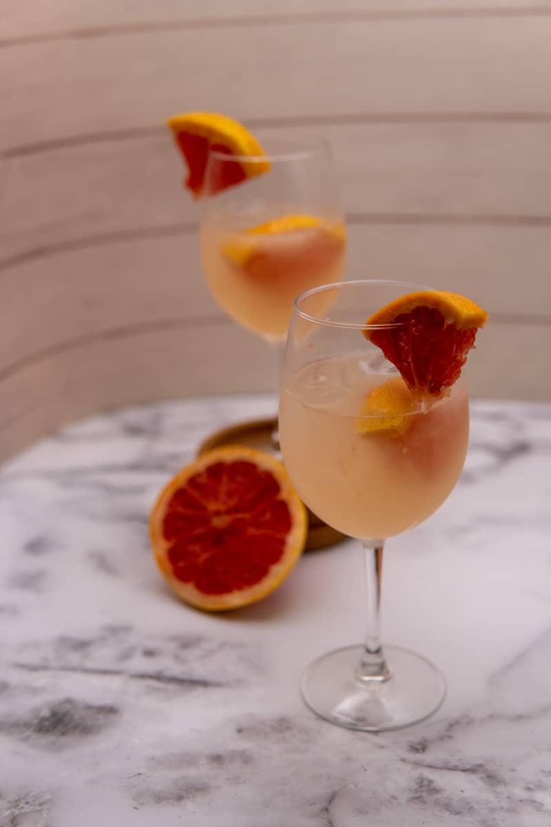 This Gin Grapefruit Cocktail is made with gin, grapefruit, seltzer water, and garnished with grapefruit slices.