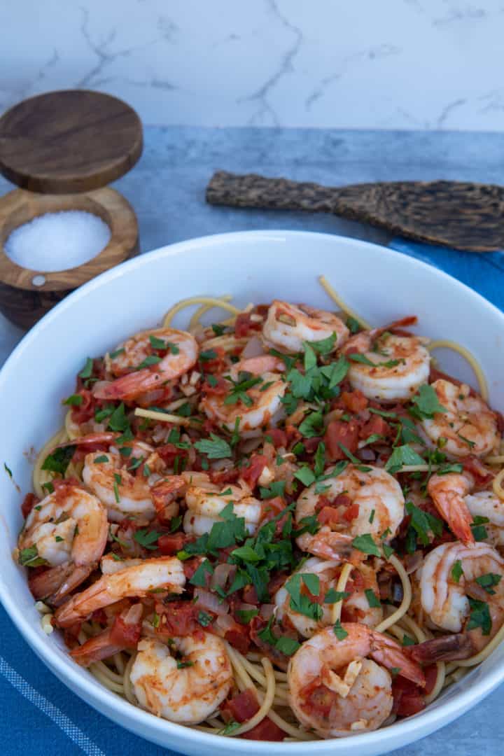 This Shrimp Fra Diavolo is made with shrimp, red pepper flakes, onion, tomatoes, white wine, garlic, parsley and served with spaghetti.