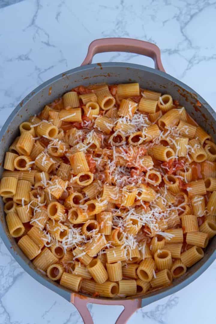 This Carbone’s Spicy Rigatoni pasta dish is made with rigatoni, butter, onions, tomatoes, Calabrian chilies, vodka, and heavy cream.