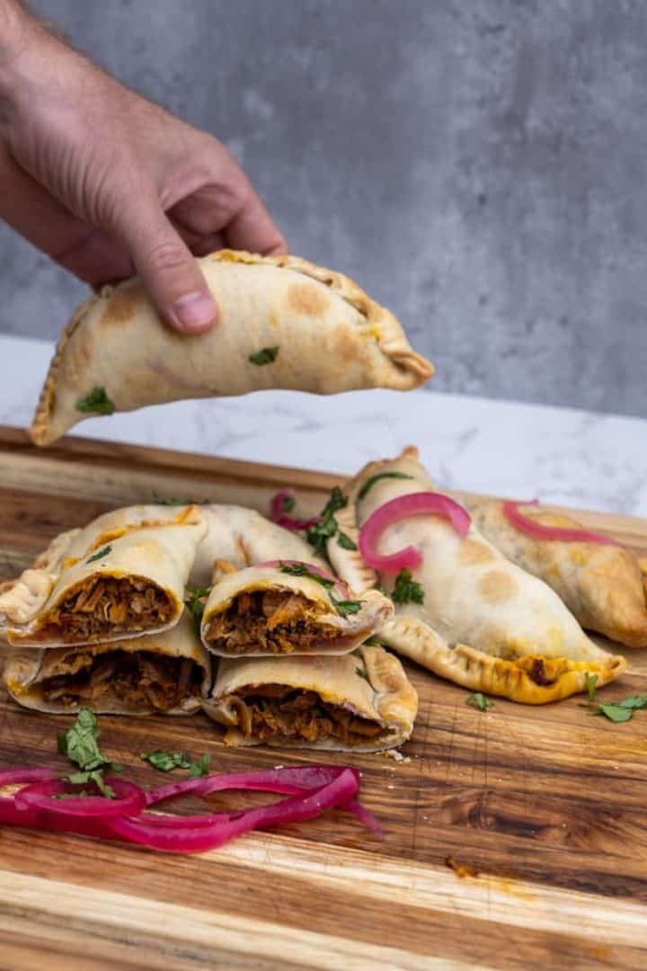This Pork Empanadas Recipe are made with your choice of pulled pork, carnitas or cochinita pibil, empanada dough discs, and olive oil.