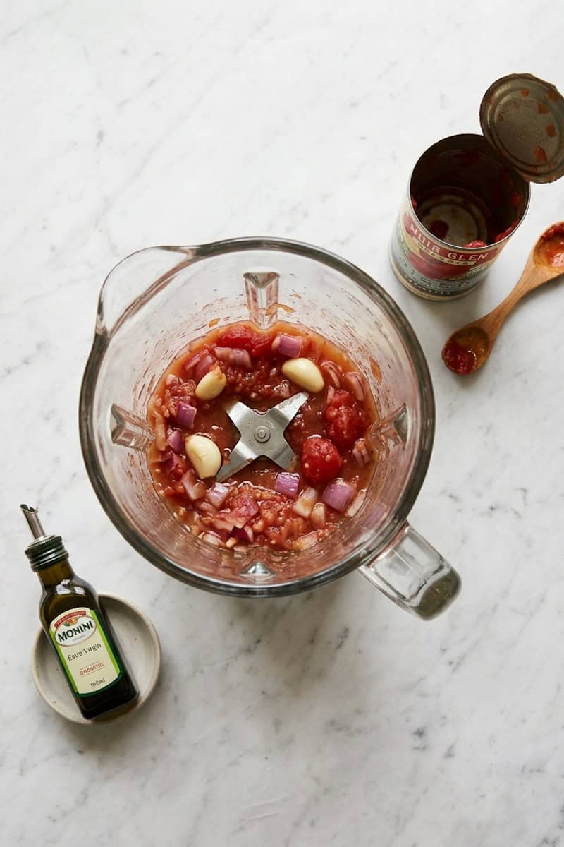 Tomatoes, star pasta, red onion, garlic, broth and olive oil for sopa de estrellas