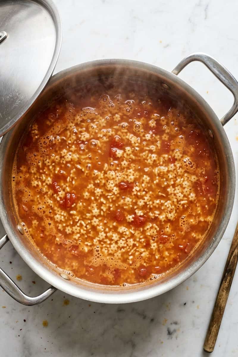 Bowl of Mexican star soup with toasted star-shaped pasta in tomato broth