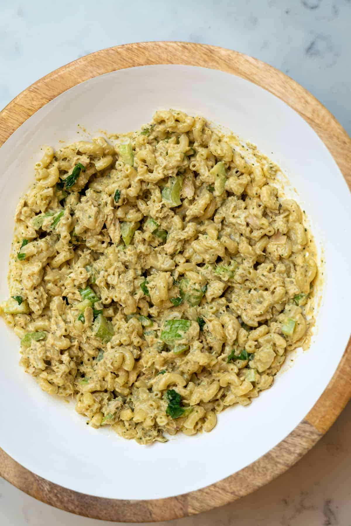 This Canned Tuna Pasta Recipe is made with tuna, pasta, basil, nuts, garlic, olive oil, parmesan, greek yogurt and lemon juice.