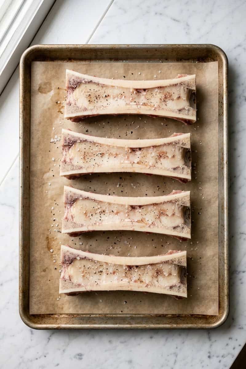 Seasoned marrow bones before cooking
