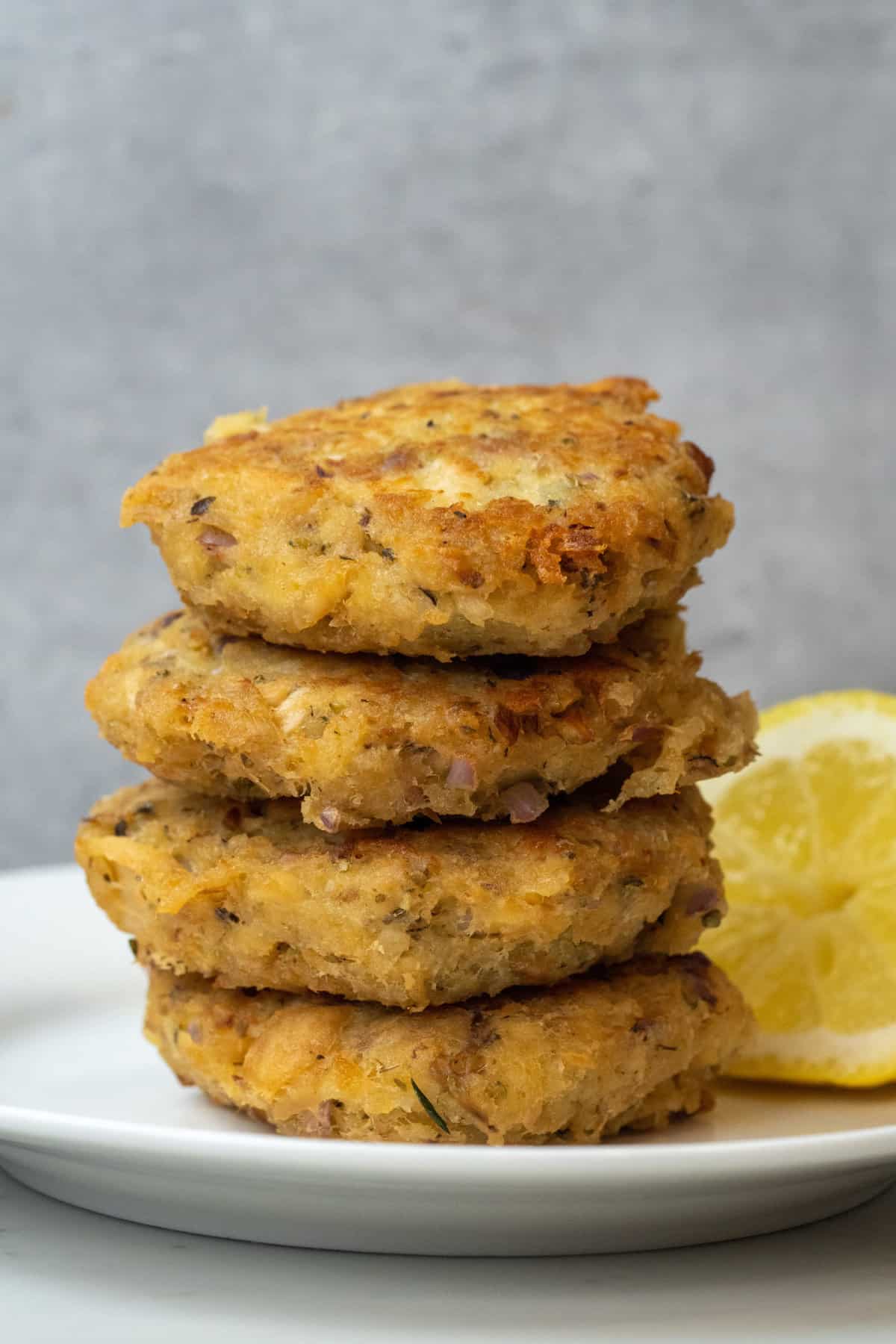 These Tuna Patties Recipe are made with tuna from a can, onion, chives, mayonnaise, crumbs, oregano, vinegar and baked to perfection.