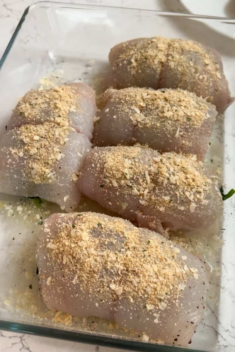Stuffed flounder rolls topped with Parmesan and breadcrumbs before baking