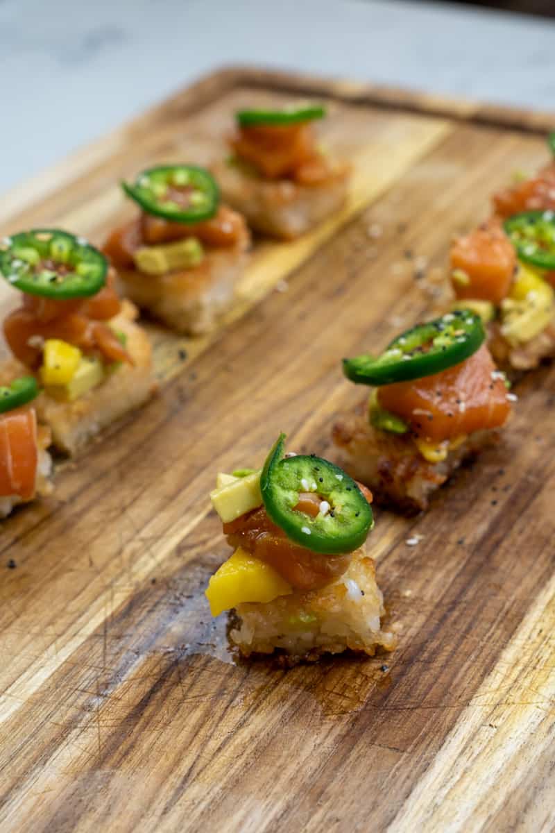 This Spicy Salmon Crispy Sushi Rice is an appetizer made with the freshest sushi-grade salmon and tossed in a delicious Asian sauce.