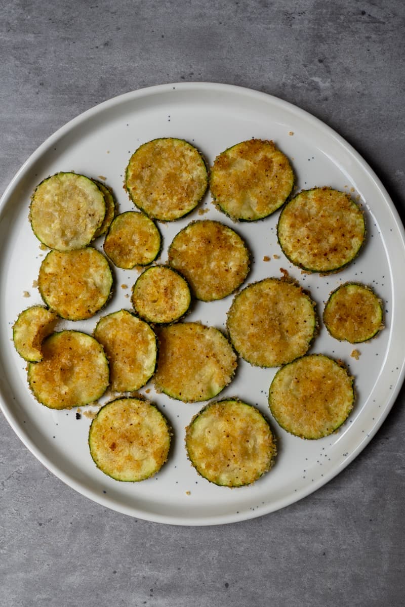 These Air Fryer Zucchini Parmesan Bites take 20 minutes to make, and you'll have the perfect snack or side for your summertime meals!