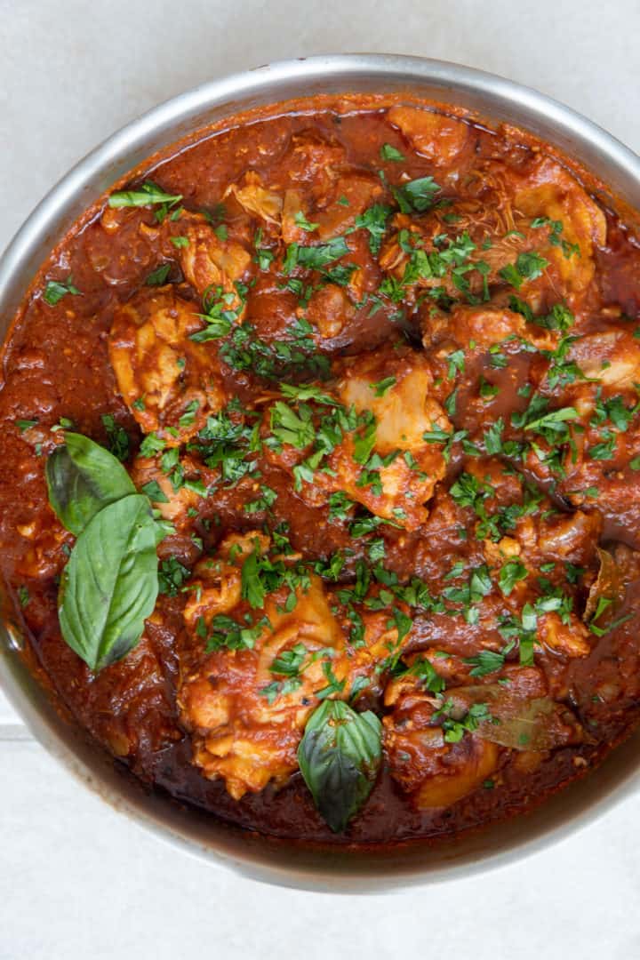 This Chicken Arrabiata Recipe is made with bone-in chicken, onions, artichokes, Arrabiata sauce, and simmered into perfection.