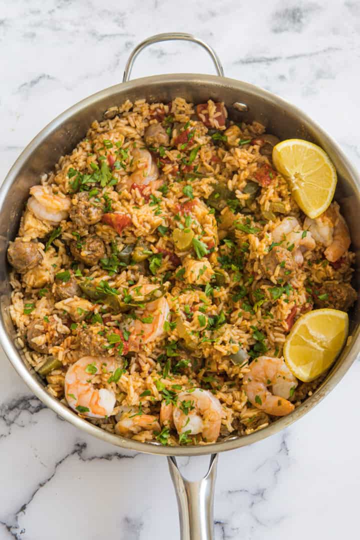 This Jambalaya is made with sausage, shrimp, chicken, lots of seasonings, tomatoes, rice, and chicken broth.