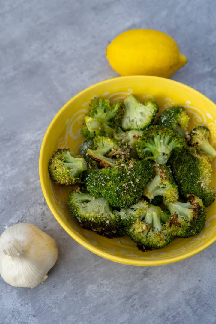 This Lemon Parmesan Broccoli is made with a head of broccoli, parmesan, garlic, lemons, olive oil, and baked into perfection.