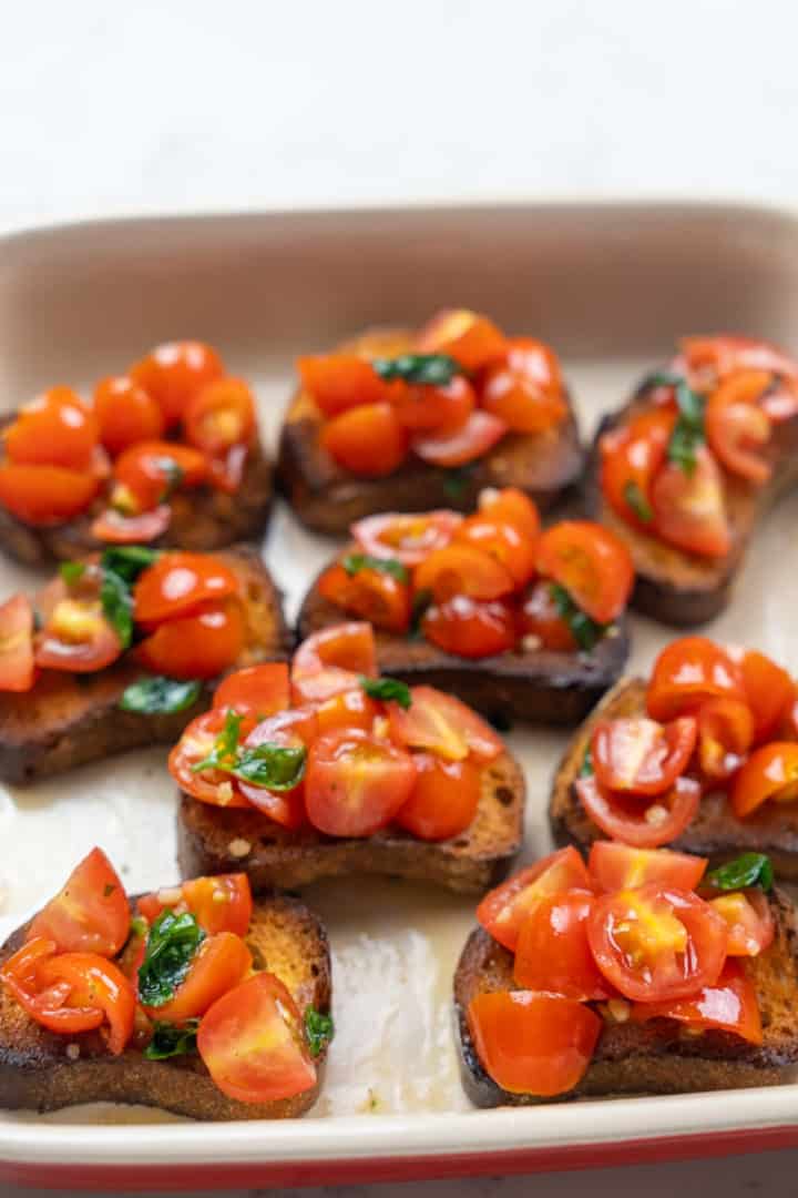 This Bruschetta Recipe is made with cherry tomatoes, basil, garlic, olive oil, salt, balsamic vinegar and served on toasted bread.