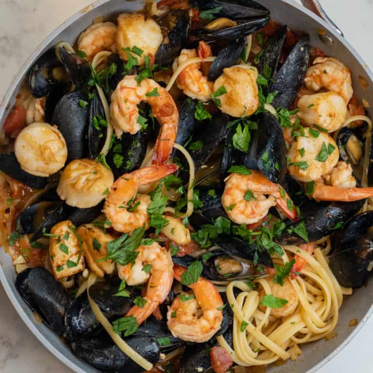 This Linguini Frutti di Mare is made with mussels, scallops, shrimp, garlic, onion, tomatoes, parsley, and freshly cooked linguini and a great Shrimp with Pasta Recipes!