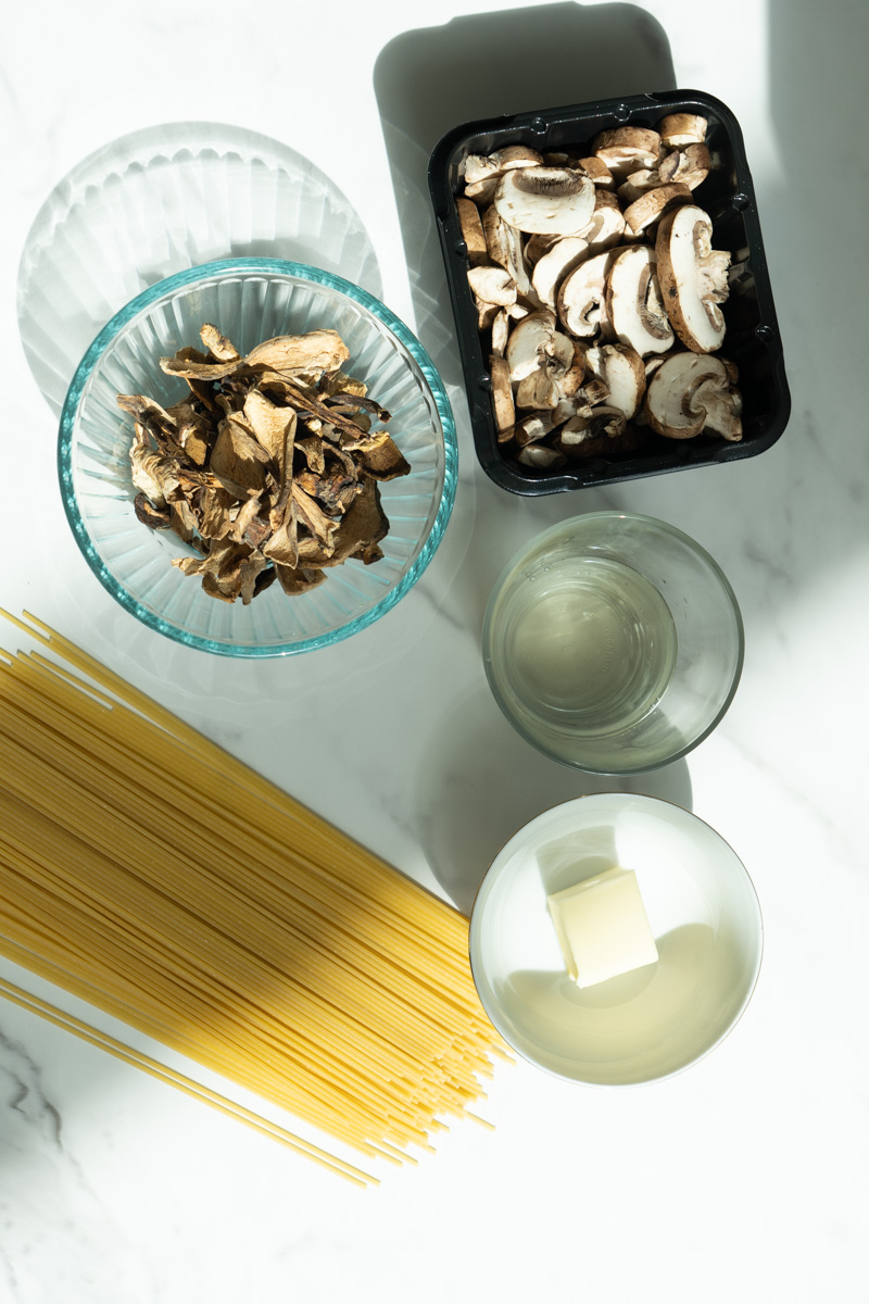 This Mushroom Pasta without Cream is made with dried porcini mushrooms, butter, white wine, pasta and topped with parmesan cheese. 
