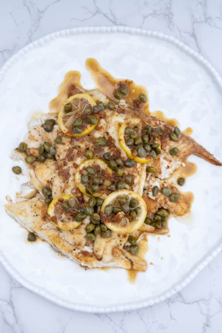 This Sautéed Flounder Lemon Capers dish is made with flounder, flour, olive oil, butter, lemons, and capers.