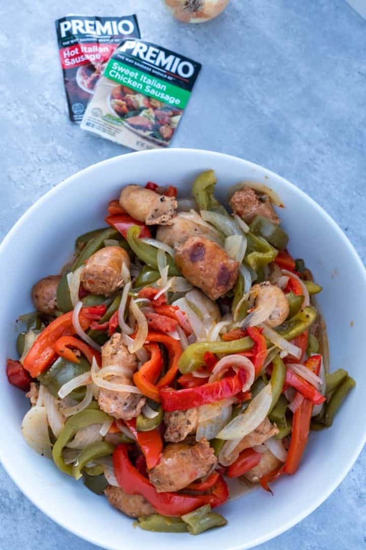 This Keto Sausage and Peppers dish is made with sweet and spicy sausages, bell peppers, onions, diced tomatoes and salt.