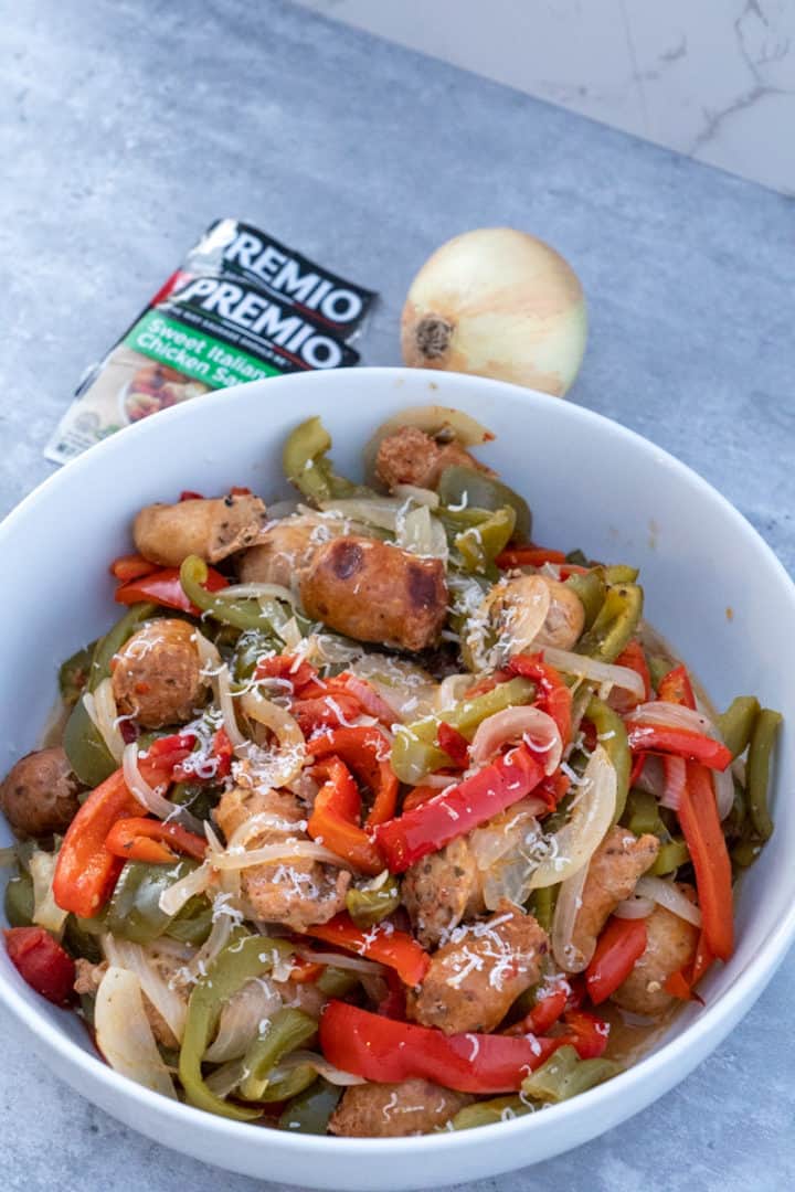 This Sausage and Peppers Recipe is made with sweet and spicy sausages, bell peppers, onions, diced tomatoes and salt.