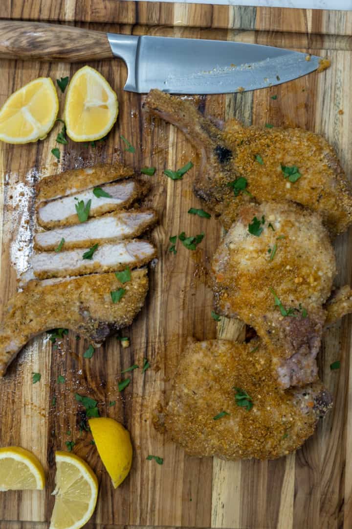 These Shake and Bake Pork Chops Recipe (Air Fryer and Oven) are made with pork chops, paprika, parmesan, thyme, and served with lemon wedges.