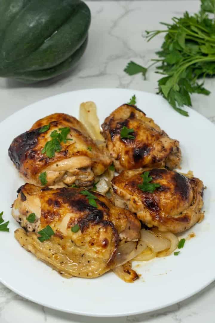 This Chicken in Italian Dressing dish is made with a whole chicken, a bottle of Italian dressing, onions, and lemons. 