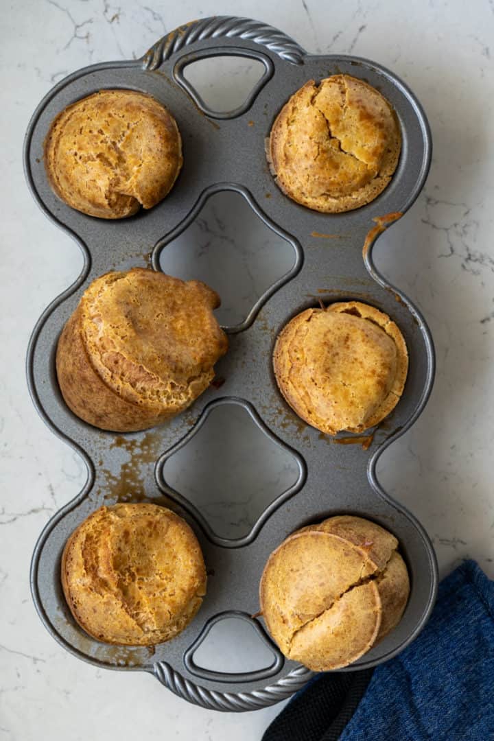 These Breakfast Popovers are made by blending milk, eggs, flour, and salt and baked into perfection.
