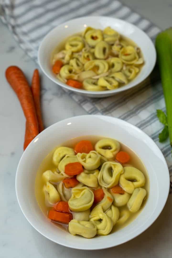 This Tortellini Soup with Chicken and Spinach is made with celery, carrots, onions, parsley, chicken, spinach, water and tortellini.