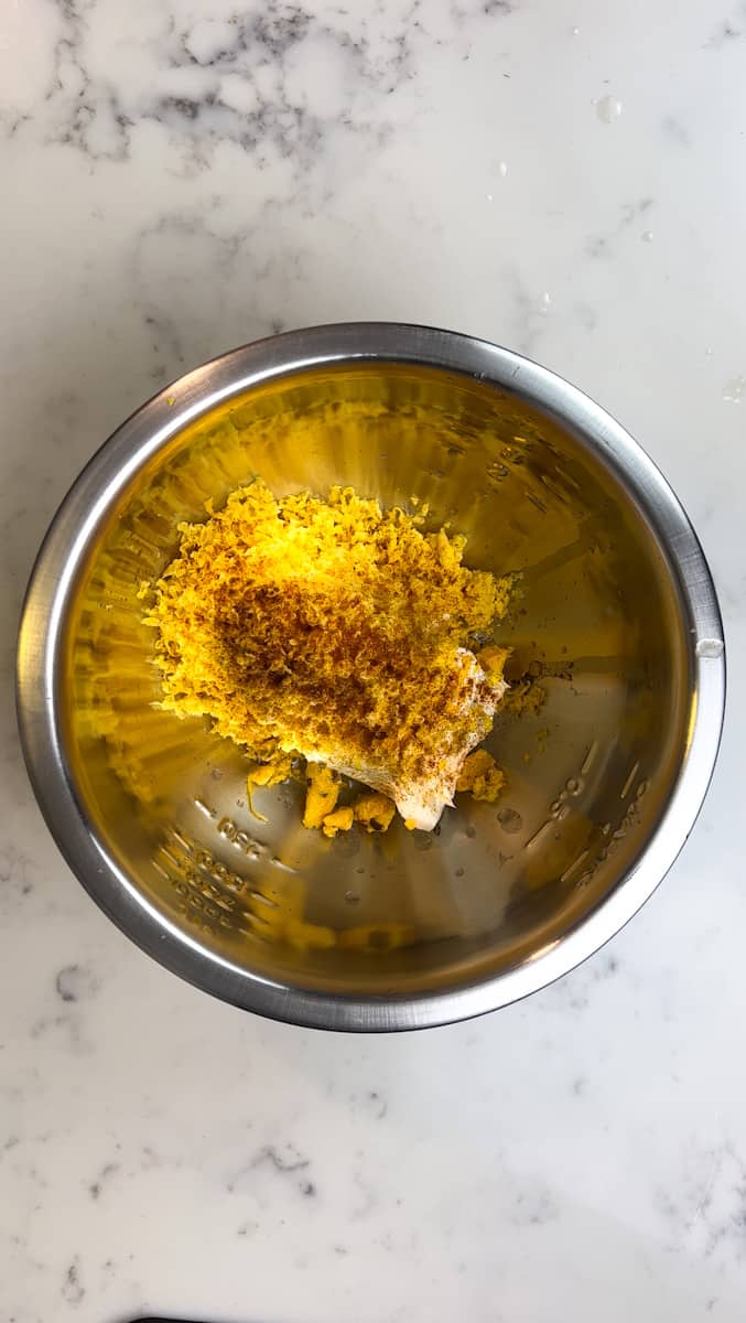 In another bowl, add the shredded cheese, cream cheese, paprika, chili powder, and lime juice and mix well.