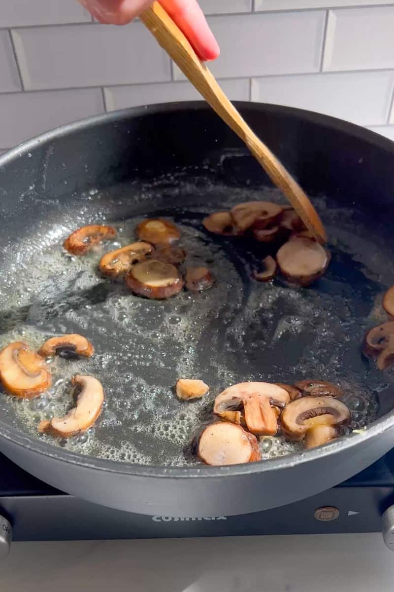 In a medium skillet, add butter until it melts. Add the baby Bella mushrooms and cook for 5 minutes. 