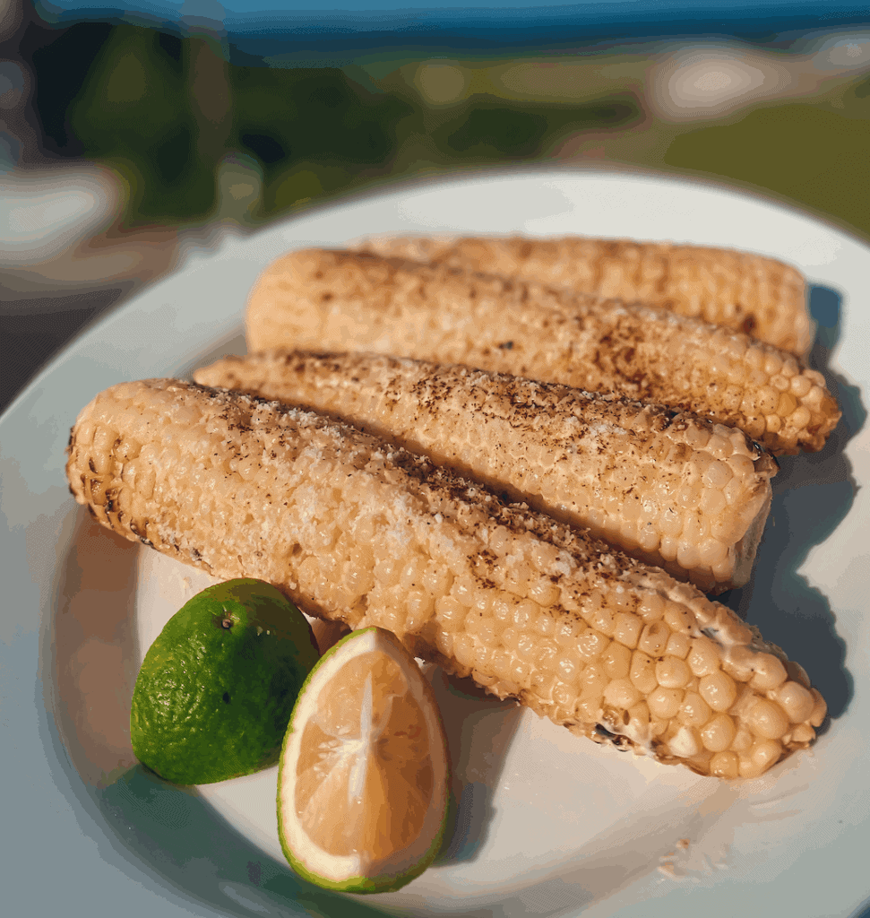 This Authentic Elote Recipe is made with corn, oil, sour cream, mayonnaise, cilantro, garlic, lime and chili powder.