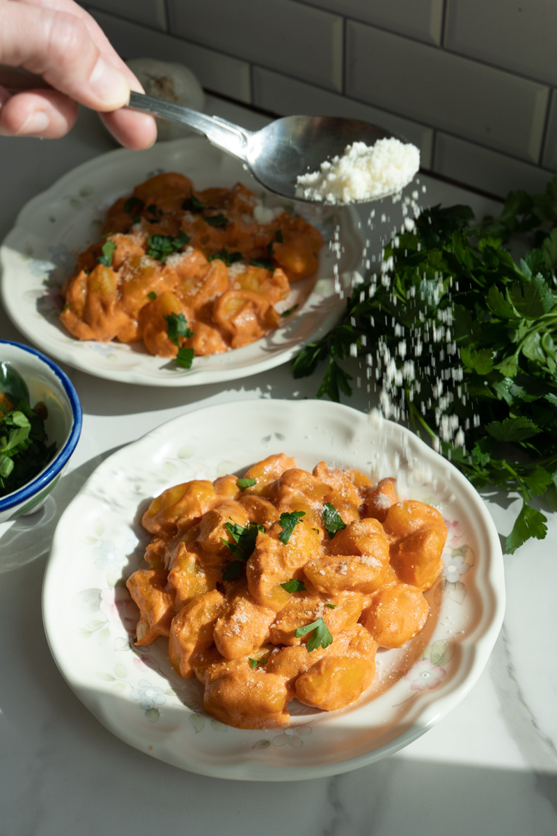 Garnish the gnocchi with parsley and parmesan cheese. Enjoy this Tomato Gnocchi with Goat Cheese!