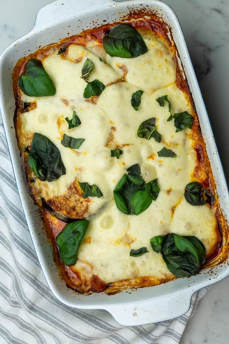 This Keto Eggplant Parmesan Pork Rinds dish is made with eggplants, parmesan cheese, pork rinds, mozzarella and baked to perfection. 