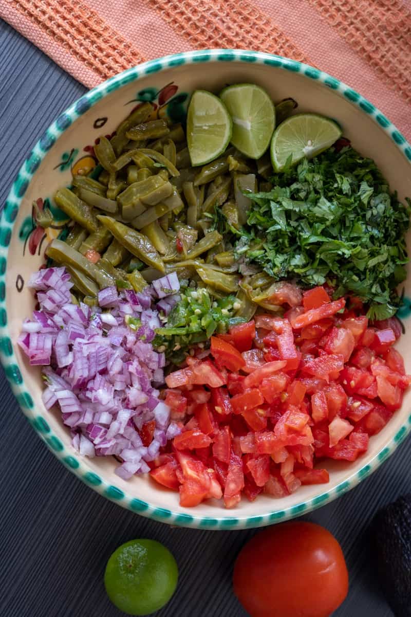 Add salt and pepper to your liking and mix. Enjoy your Mexican Nopales Salad (Cactus Salad).