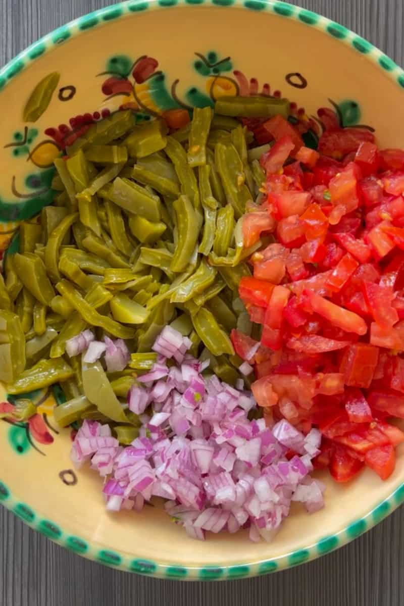 Add the tomatoes, onion, and cilantro. 