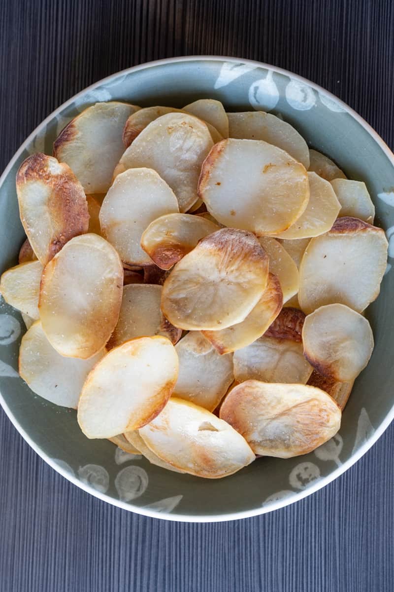 These Baked Salt and Vinegar Chips are made with russet potatoes, soaked in vinegar, and baked to perfection.