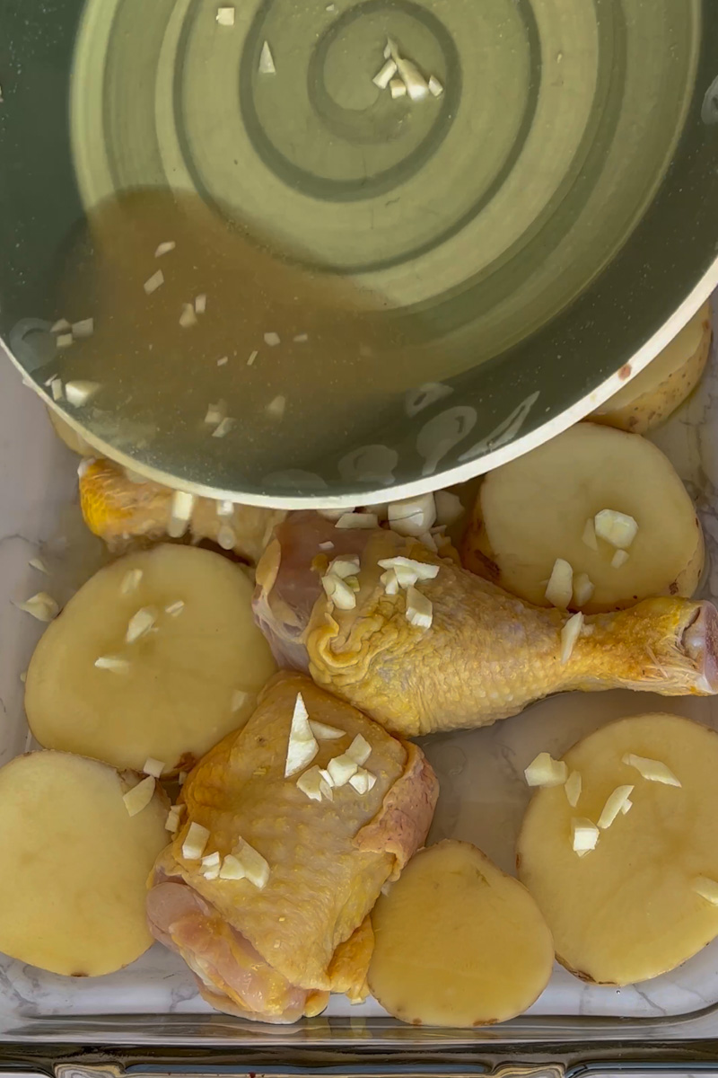 Take the baking pan out, and pour the leftover marinade over the chicken. Place the chicken back in the oven and bake for another 25 minutes. 