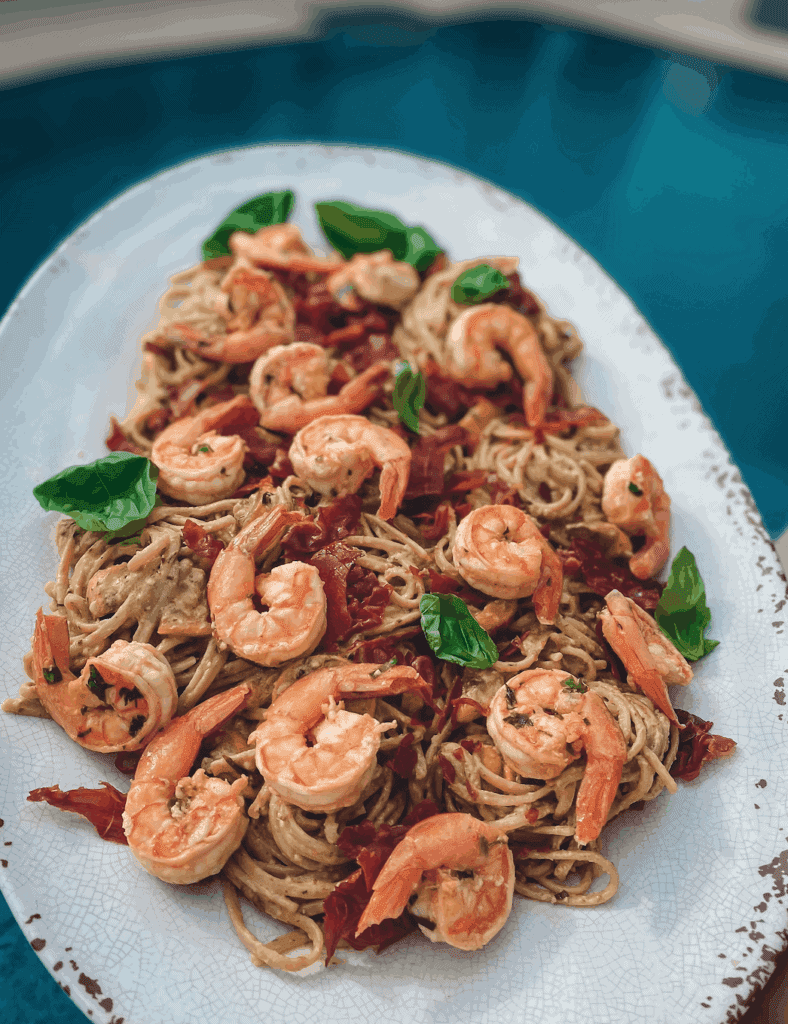 This Goat Cheese Pesto Pasta with Shrimp and Prosciutto is made with linguini, prosciutto, shrimp, goat cheese, pesto, lemons and cheese. 