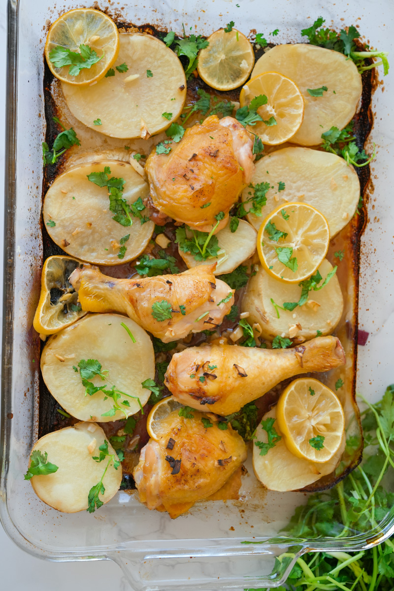 This Baked Lemon Chicken and Potatoes Recipe is made with bone-in chicken, garlic, lemons, potatoes and baked to perfection. 