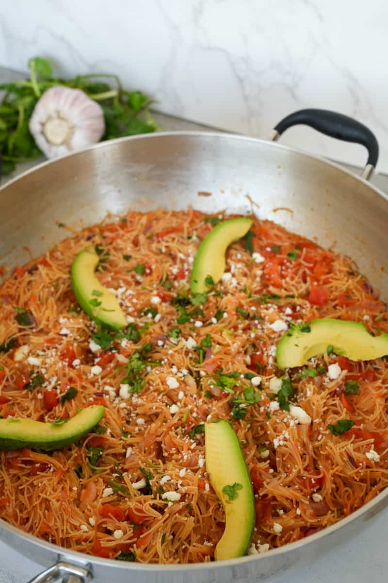Garnish with sliced avocado, cilantro, and cotija cheese. Enjoy this Mexican Noodle Casserole (Sopa Seca) Recipe.