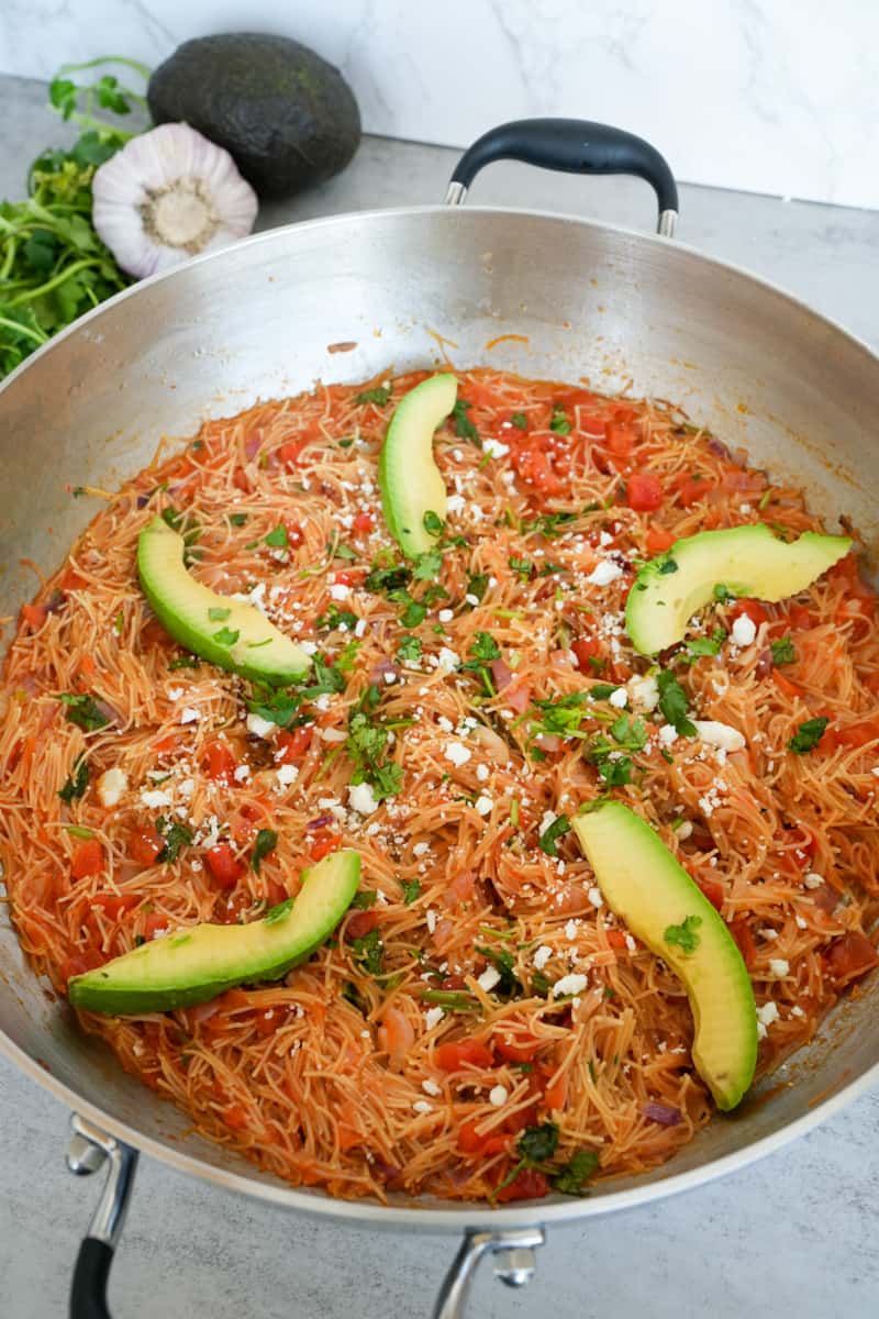 This Mexican Noodle Casserole (Sopa Seca) Recipe contains fideos, onion, garlic, and tomato. 