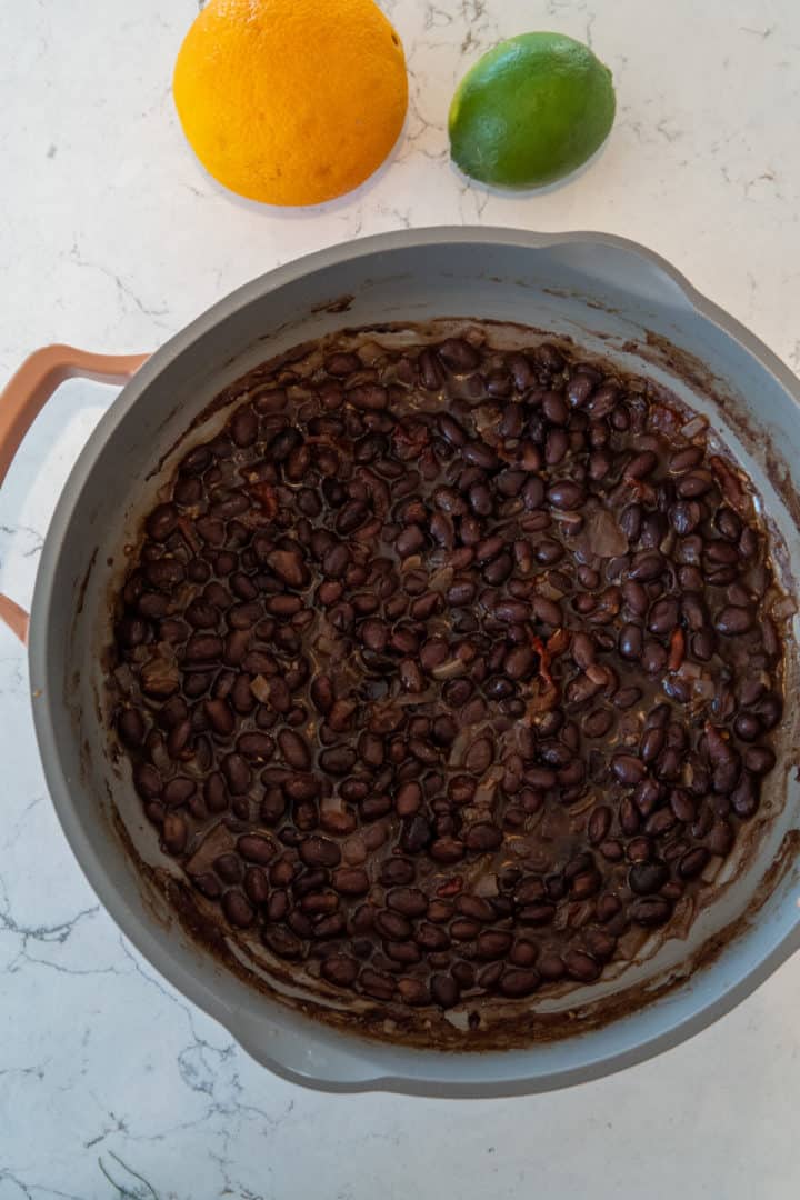 This Chipotle Black Beans Recipe are made with black beans, olive oil, onion, garlic, chipotle, bay leaves, limes and cilantro.