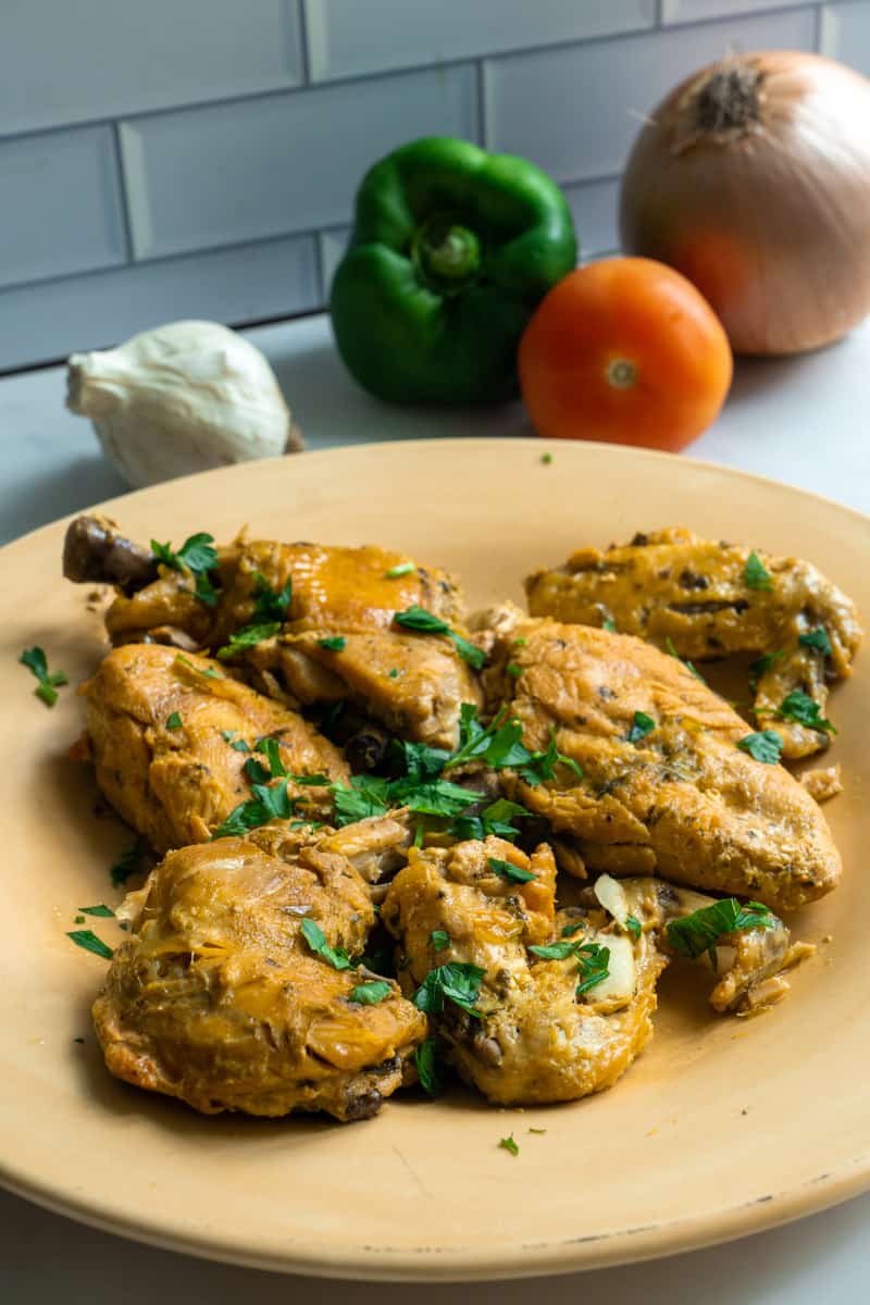 This Dominican Chicken with Sofrito and Sazon dish is made with a whole chicken, sazon completa, adobo, sofrito and braised to perfection!
